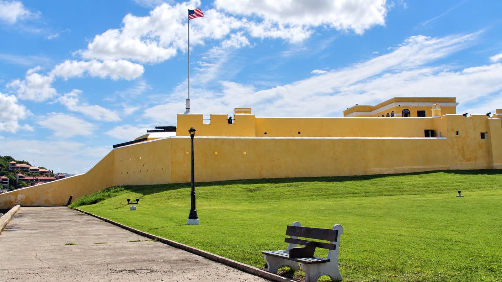 Yellow fort walls and a lawn at Fort Christiansvaern in Christiansted, St. Croix.