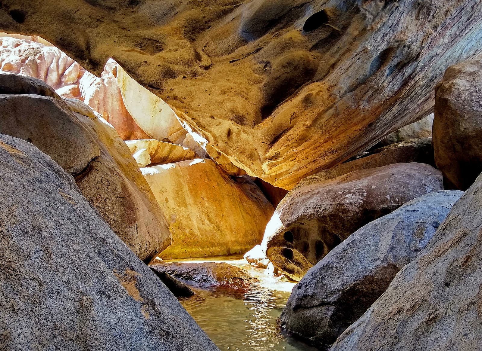 Granite boulders and a sunlit pool at The Baths, Virgin Gorda